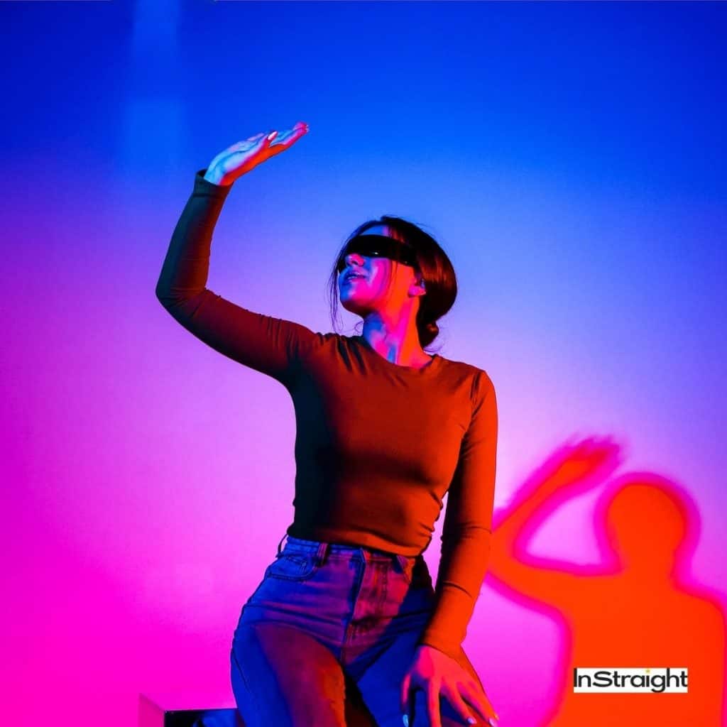 lady covering her eyes from fluorescent lighting under title Are LED Makeup Mirrors Bad For Your Eyes?